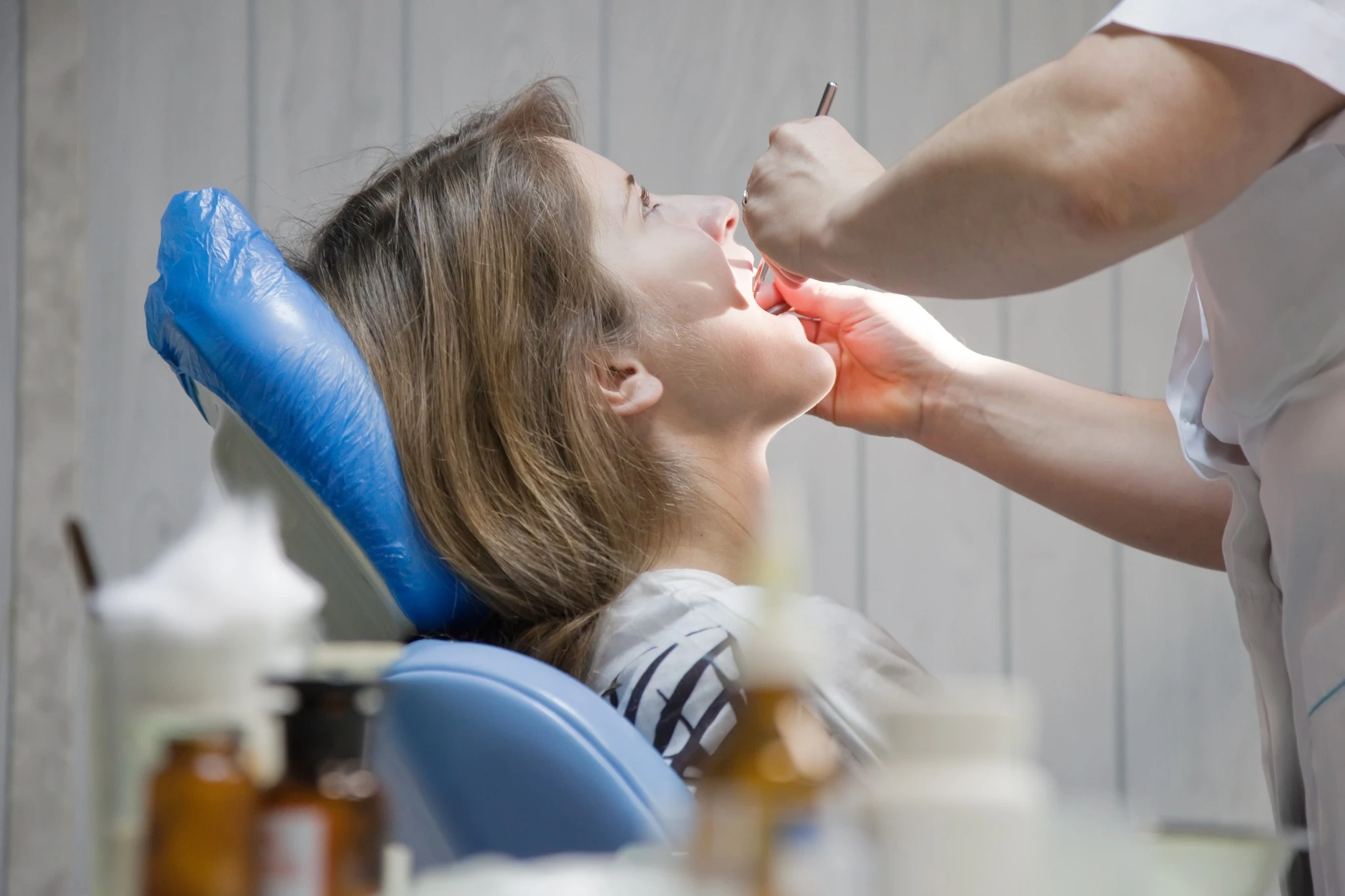 Patient undergoing dental examination before extraction